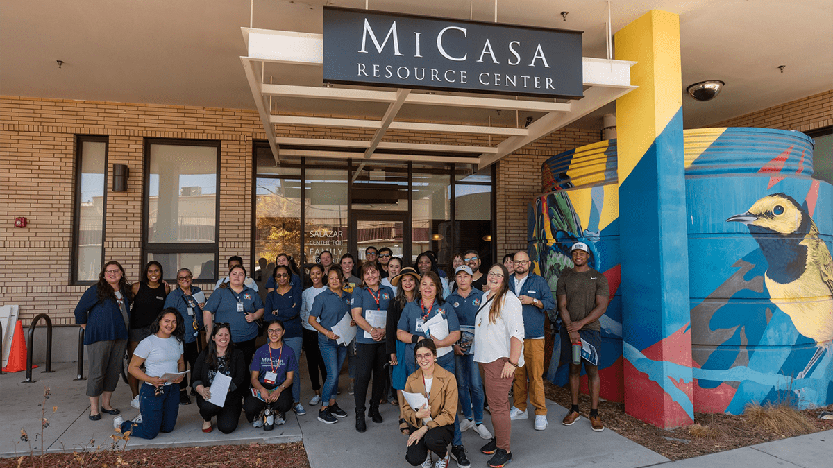 Business Navigators on a canvassing day posing in front of Mi Casa Resource Center.