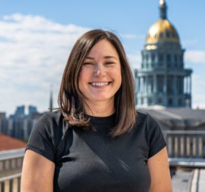 Rebecca Balu in front of the Colorado Capitol building