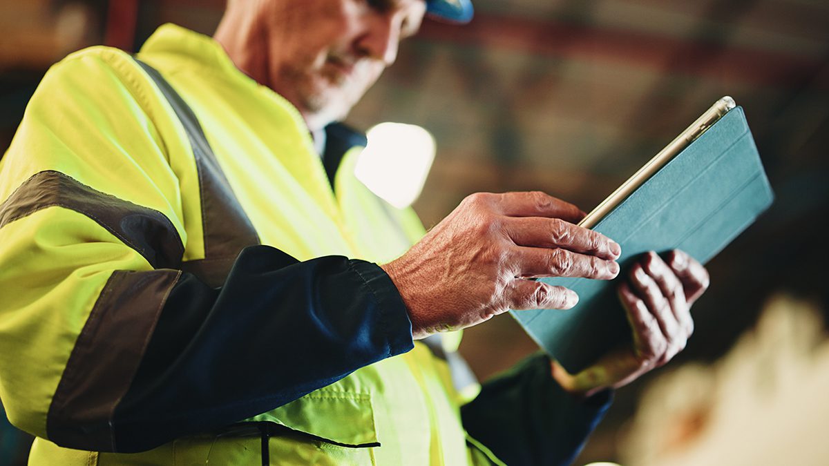 Tablet, hands and mature man in warehouse with email for cargo information with supply chain. Digital technology, industry and logistics manager with online inventory for stock delivery from below