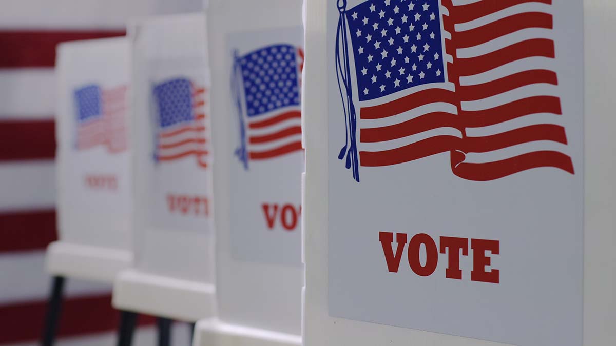 CU straight on row of voting booths at polling station during Am